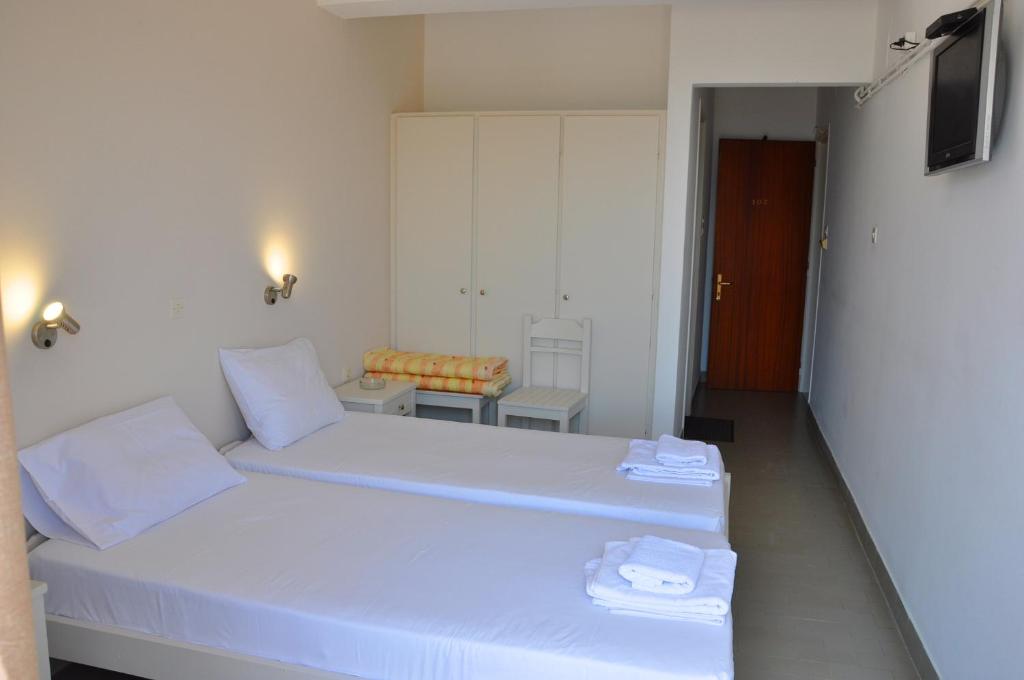 Postel nebo postele na pokoji v ubytování Nora Hotel