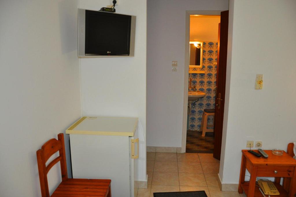 TV a/nebo společenská místnost v ubytování Nora Hotel