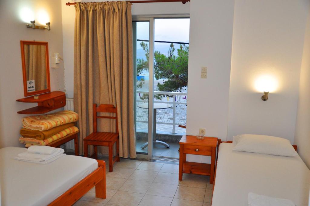 Postel nebo postele na pokoji v ubytování Nora Hotel