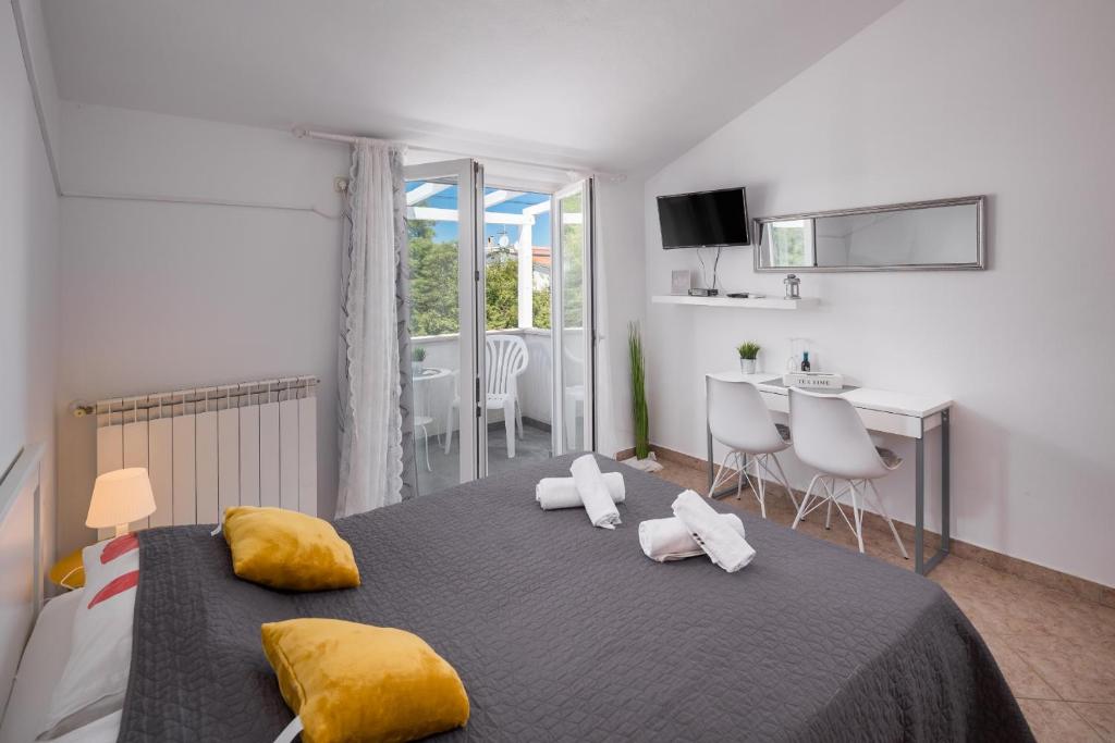 Postel nebo postele na pokoji v ubytování Martina Guest house
