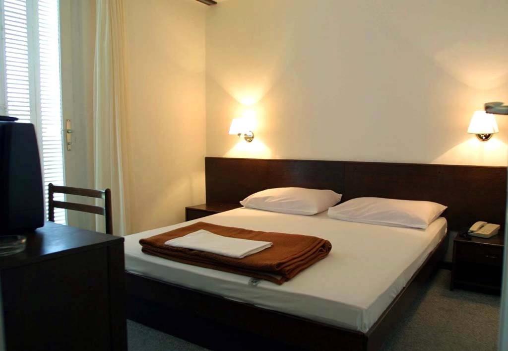 Postel nebo postele na pokoji v ubytování Hotel Adriatic
