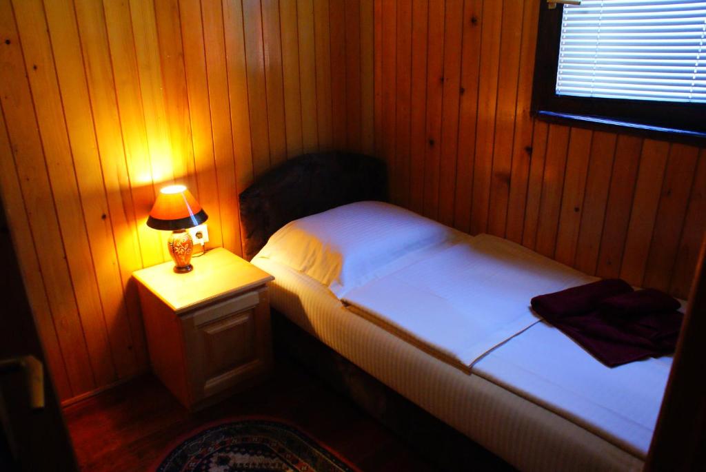 Postel nebo postele na pokoji v ubytování Hotel Ravnjak