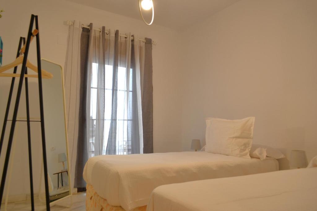 Posteľ alebo postele v izbe v ubytovaní SunShine Patio del Consistorio