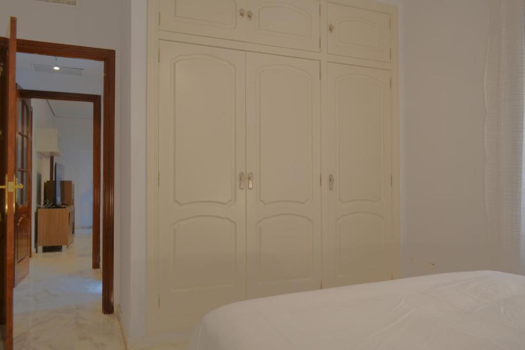 Posteľ alebo postele v izbe v ubytovaní SunShine Patio del Consistorio