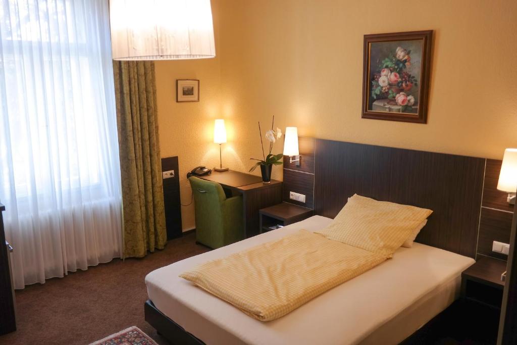 Postel nebo postele na pokoji v ubytování Hotel Villa Glas