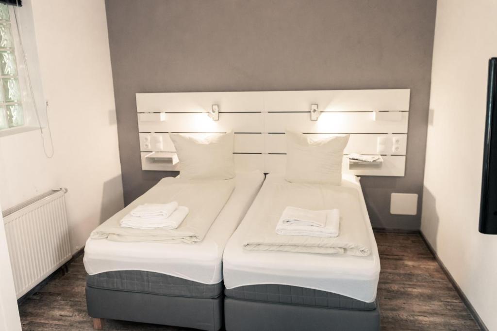 Postel nebo postele na pokoji v ubytování Hotel Scharfes Eck