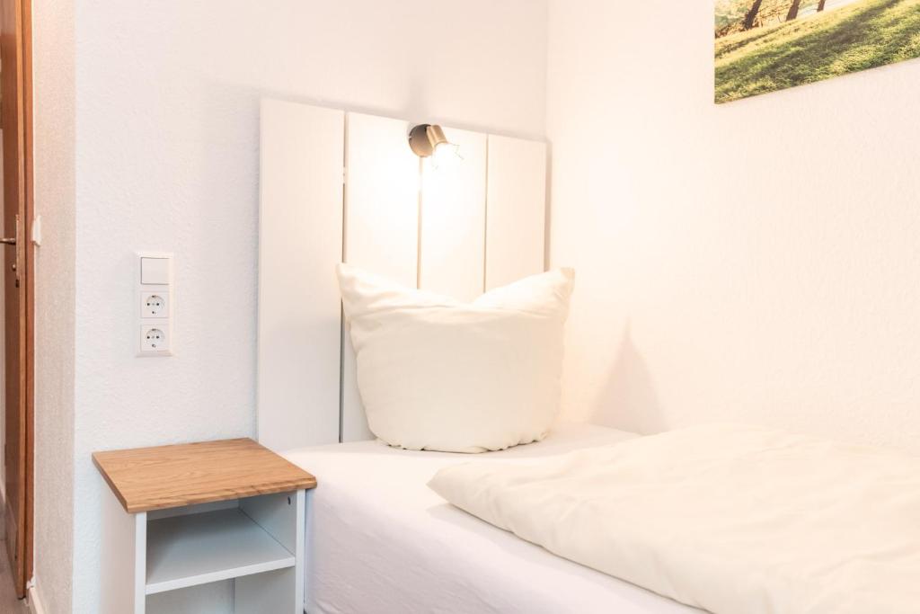 Postel nebo postele na pokoji v ubytování Hotel Scharfes Eck
