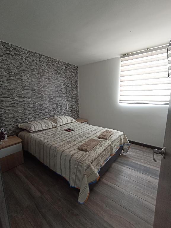 Postelja oz. postelje v sobi nastanitve Apartamento Nuevo en Bochalema