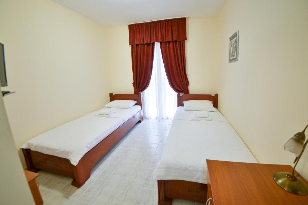 Ένα ή περισσότερα κρεβάτια σε δωμάτιο στο Hotel Podostrog