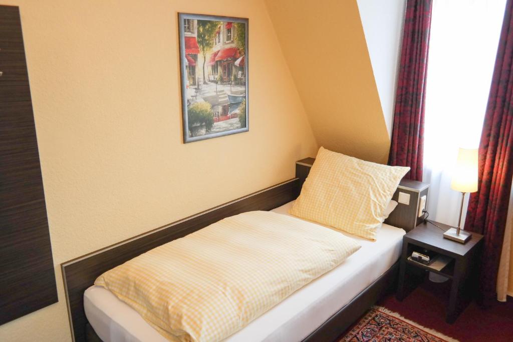 Postel nebo postele na pokoji v ubytování Hotel Villa Glas