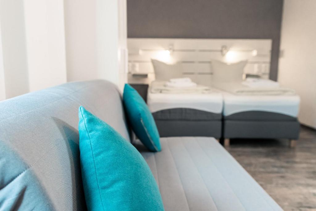 Postel nebo postele na pokoji v ubytování Hotel Scharfes Eck
