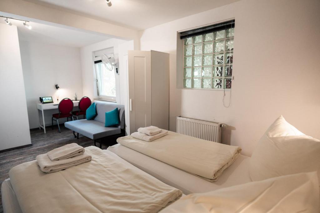 Postel nebo postele na pokoji v ubytování Hotel Scharfes Eck