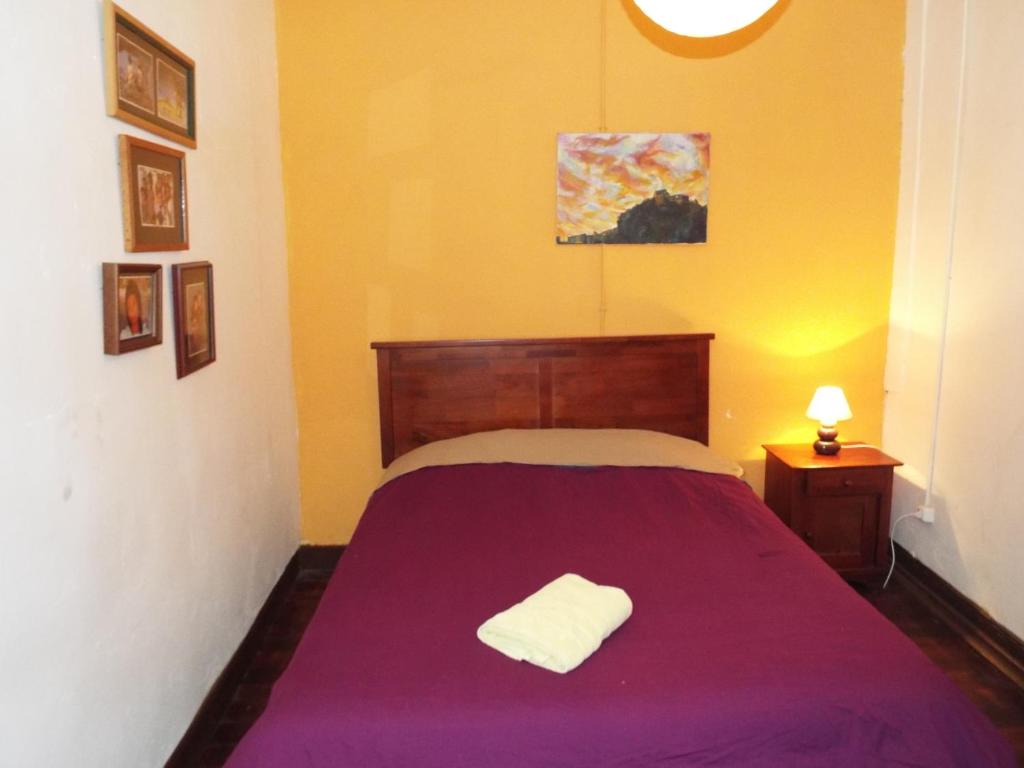 Postel nebo postele na pokoji v ubytování Hostal Casa Verde Limón
