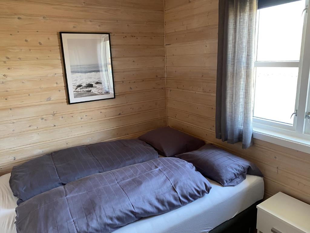 Una cama o camas en una habitaci&oacute;n de Brygga p&aring; D&oslash;nna
