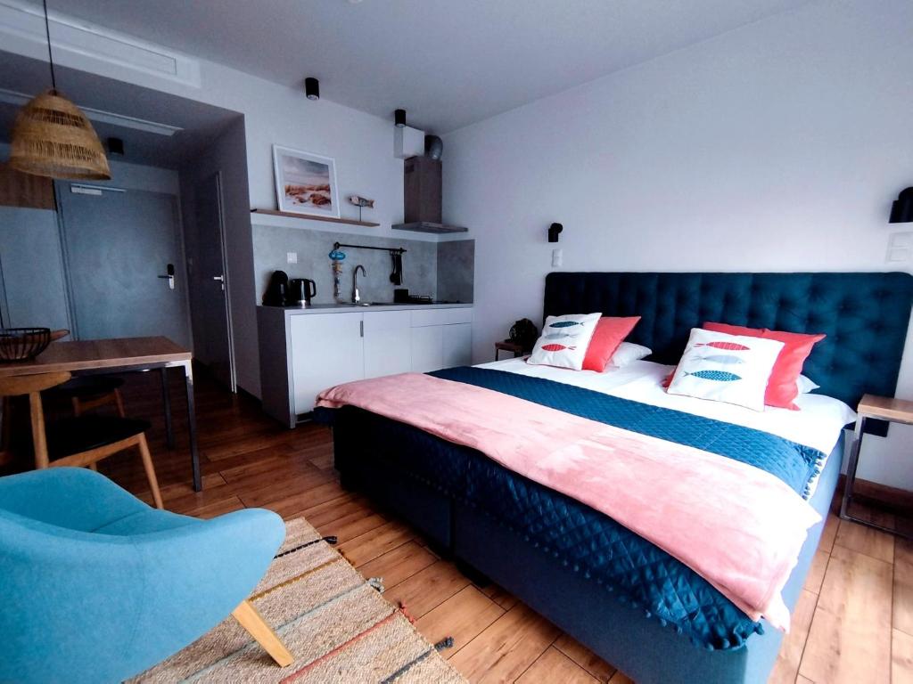 Postel nebo postele na pokoji v ubytování Magda Aparthotel Anchoria Mechelinki