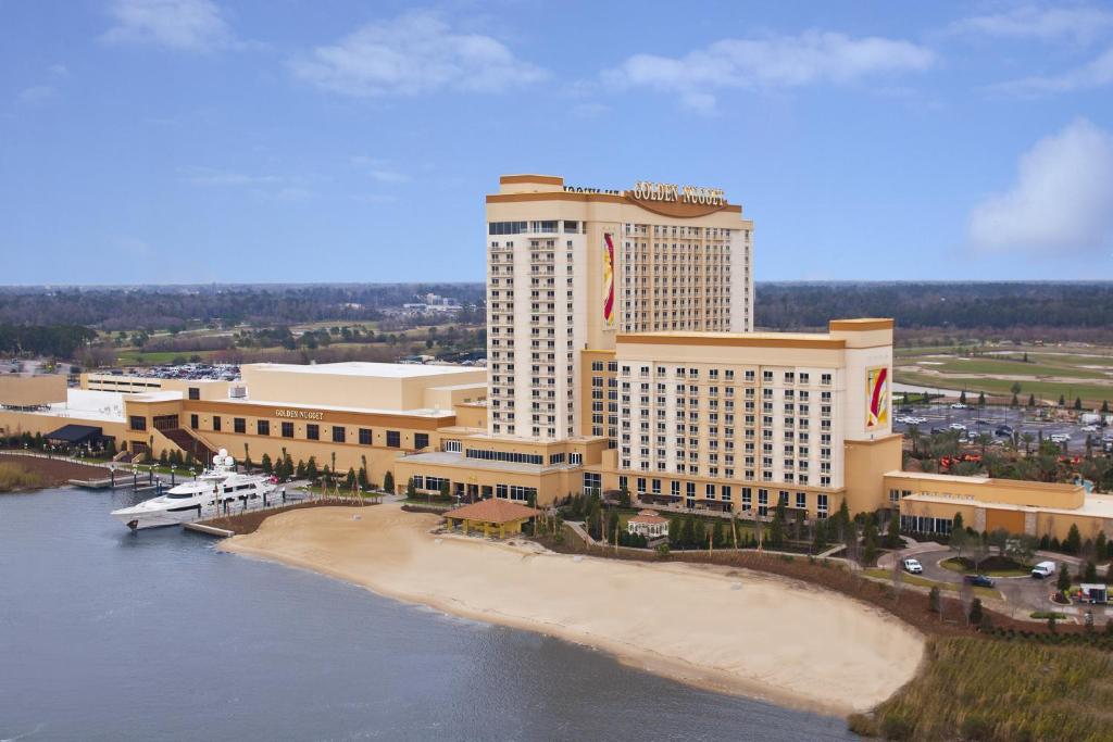 an aerial view of a hotel with a beach at Golden Nugget Lake Charles in Lake Charles