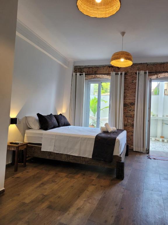 Postel nebo postele na pokoji v ubytování Pelourinho Boutique Hotel - OH HOTÉIS