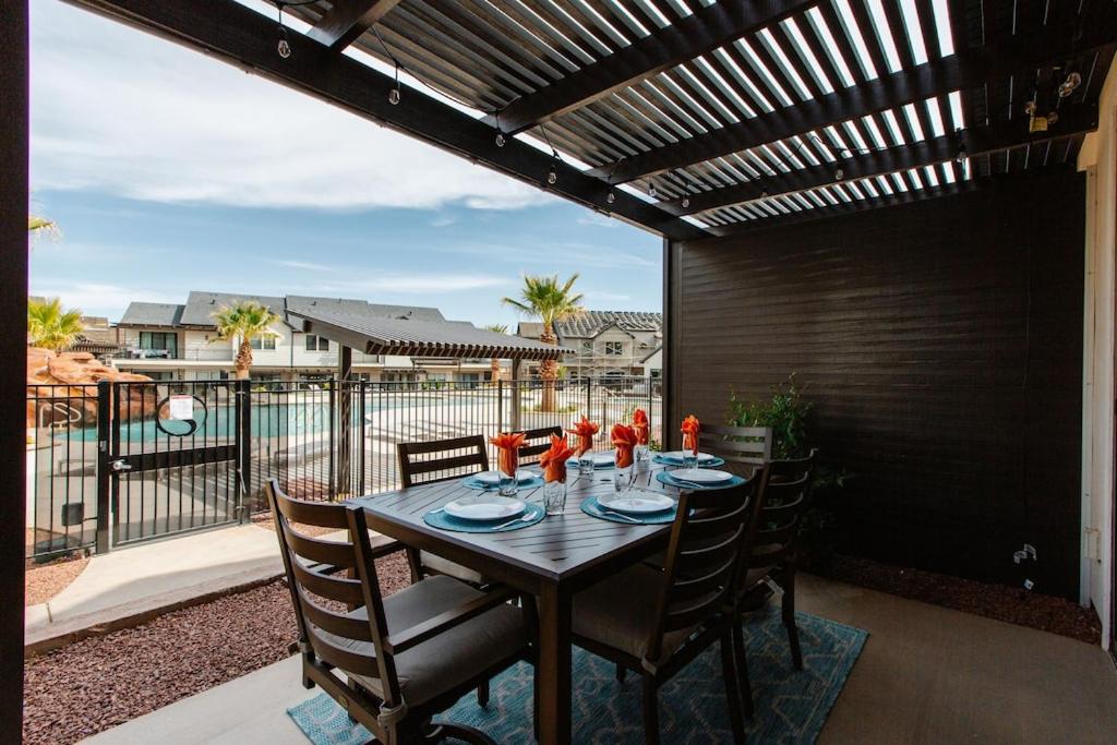 a table on a patio with a view of the water at Ocotillo Springs 4 Ping Pong Table, X Box One, and close access to the Community Pool in Santa Clara