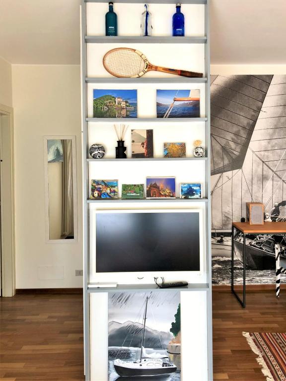 A television and/or entertainment centre at Mascalzone Latino, City center apartment