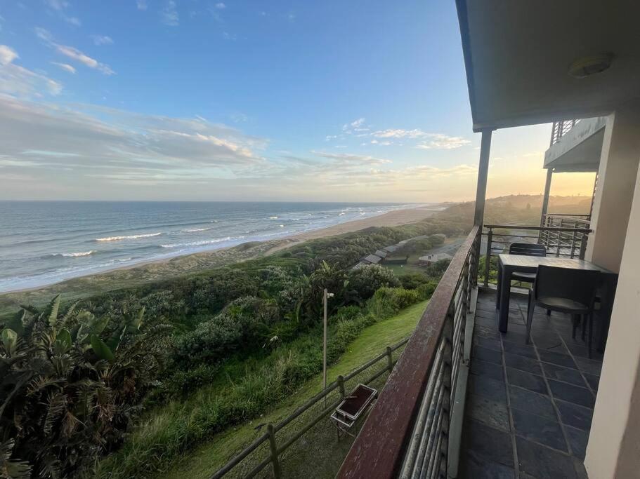 a view of the ocean from the balcony of a house at Beach Escape on the coast at apartment 78 Sancta Maria in Amanzimtoti
