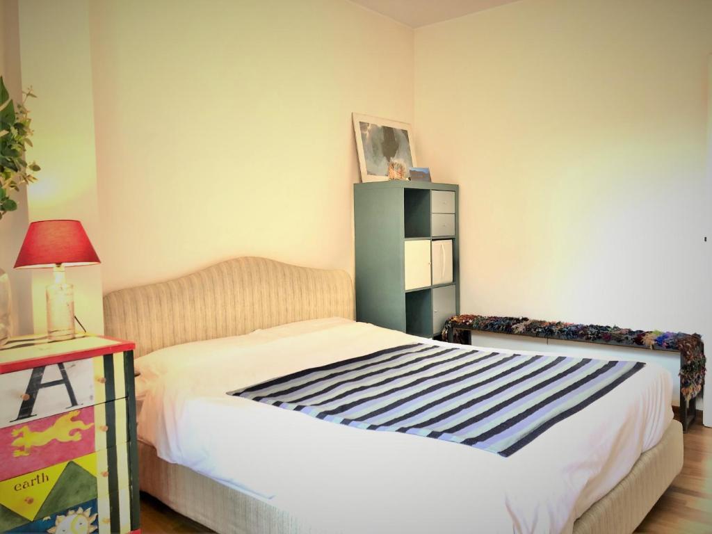 A bed or beds in a room at Mascalzone Latino, City center apartment