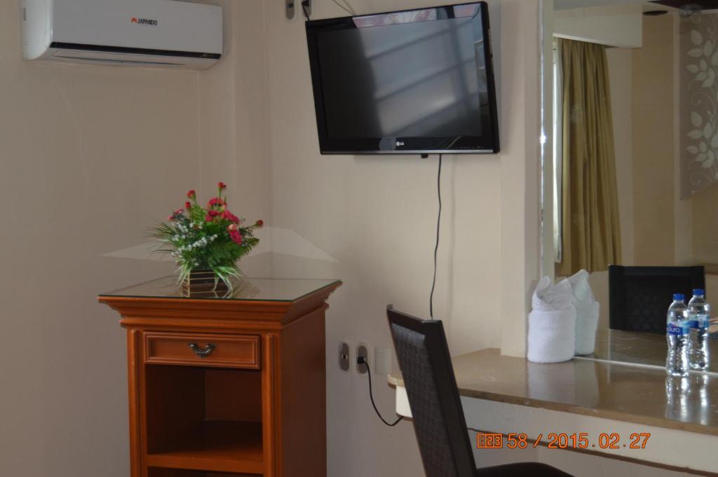 TV a/nebo společenská místnost v ubytování Hotel Impala Veracruz