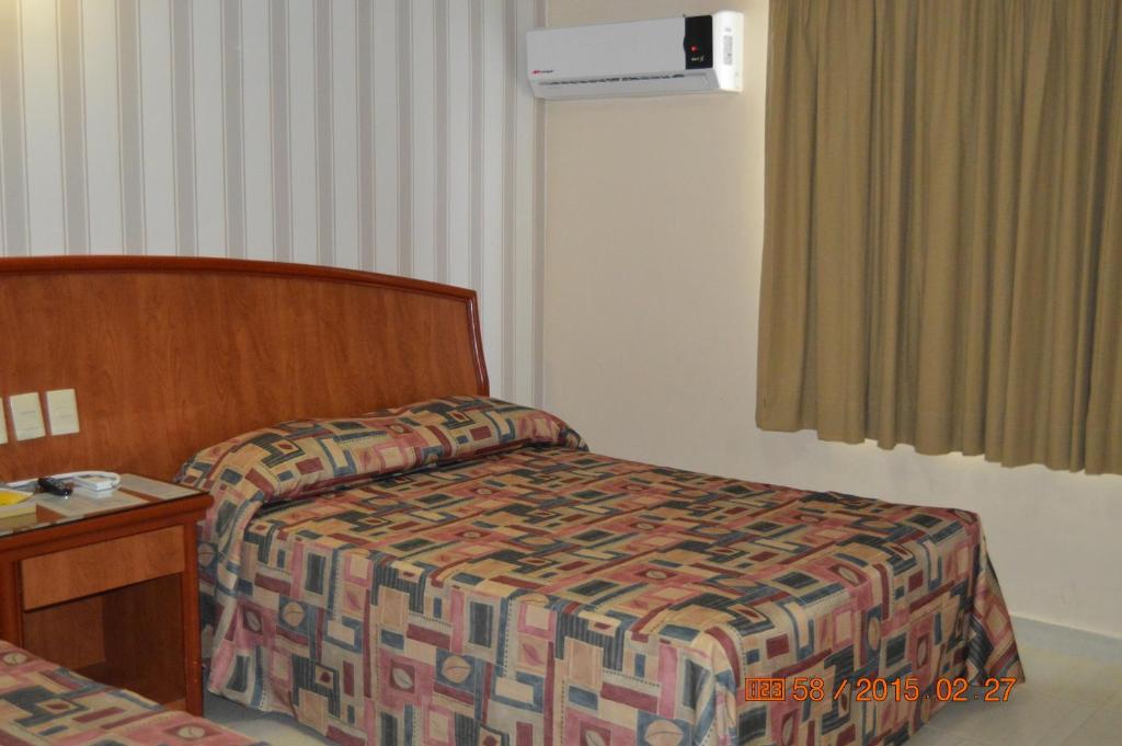 Postel nebo postele na pokoji v ubytování Hotel Impala Veracruz