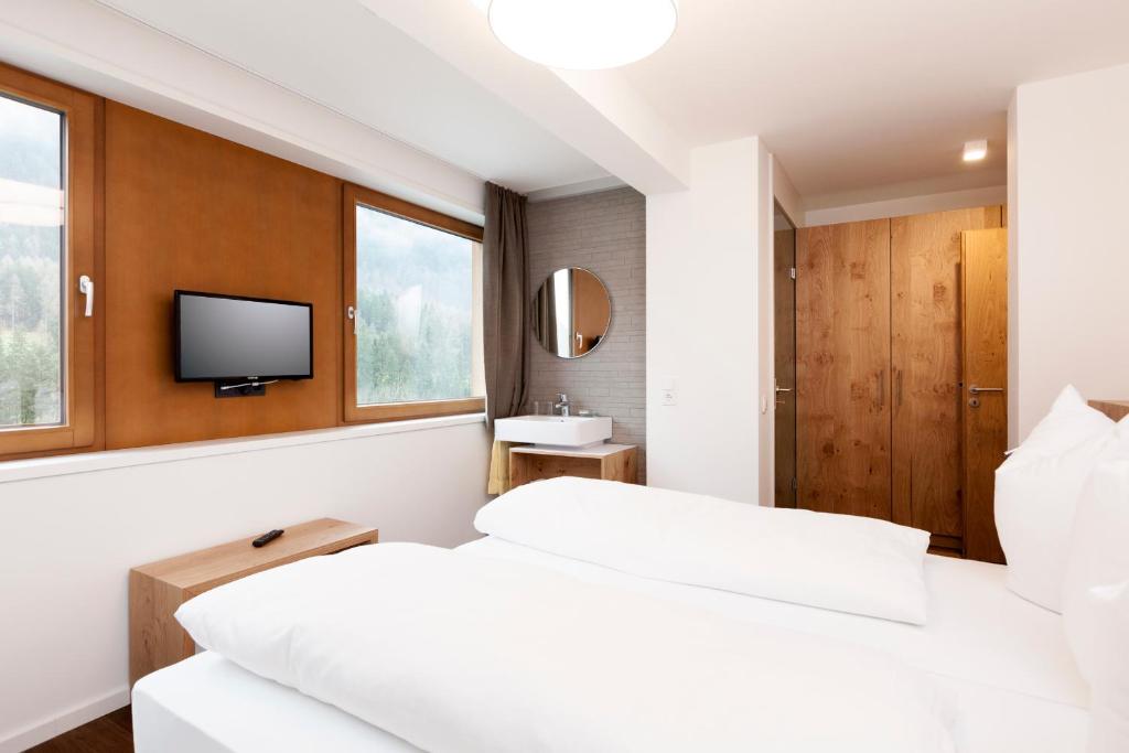 Postel nebo postele na pokoji v ubytování Valschena Appartements