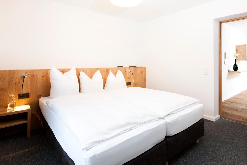 Postel nebo postele na pokoji v ubytování Valschena Appartements