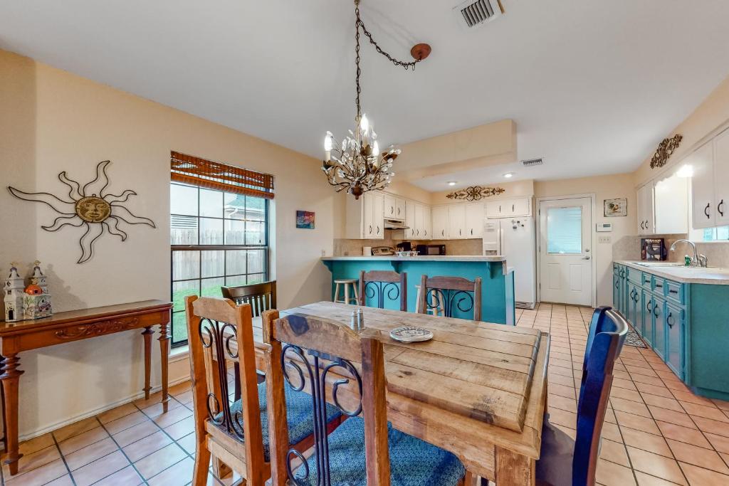 a kitchen with a table and chairs and a dining room at Birder's Heaven at 621 Palm in Laguna Vista