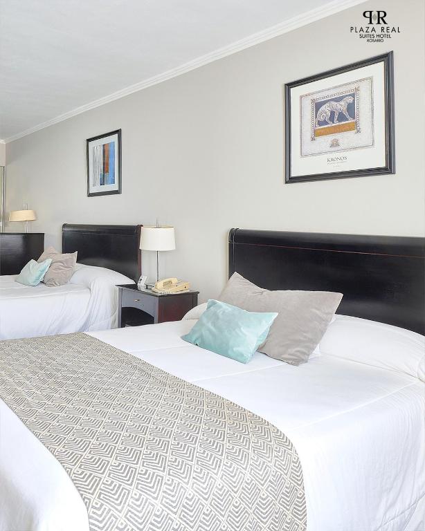 Plaza Real Suites Hotelにあるベッド
