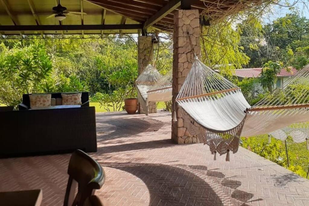 a porch with two hammocks on a patio at Vista Gaital/ Gaital View in Antón