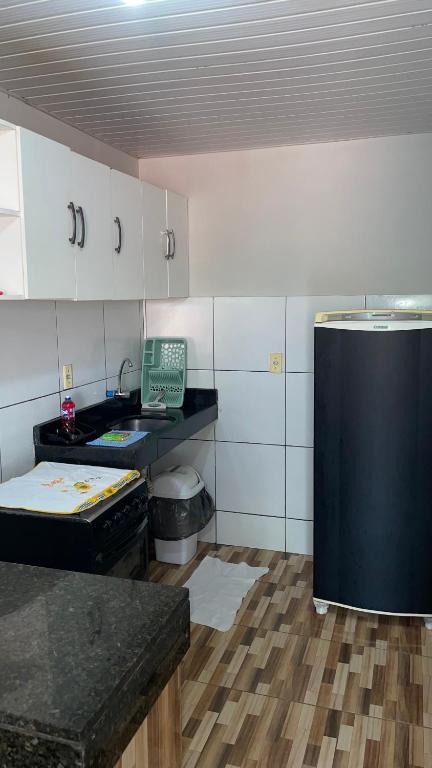 Kuchyň nebo kuchyňský kout v ubytování Apartamento do Walisson