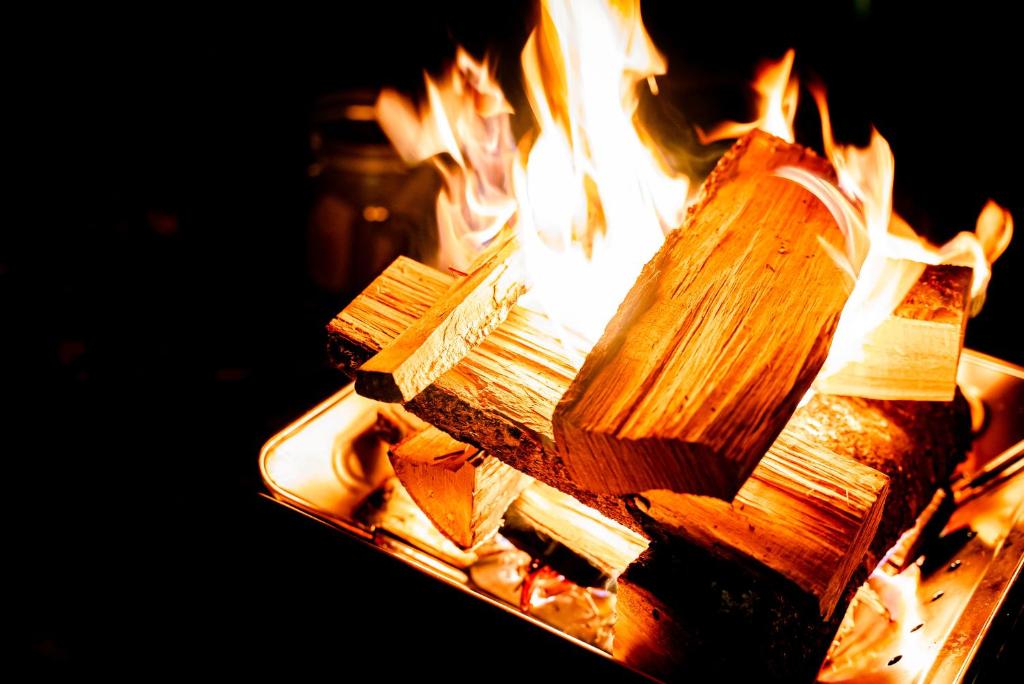 a close up of a fire in a grill at 煙神キャンプヴィレッジ in Toyooka