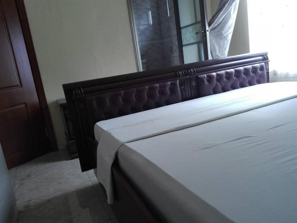 a close up of a bed in a bedroom at Matalente Abode in Lilongwe