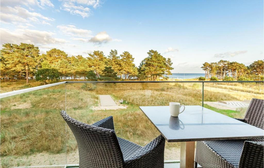 a table and chairs with a view of the ocean at Princess in Binz