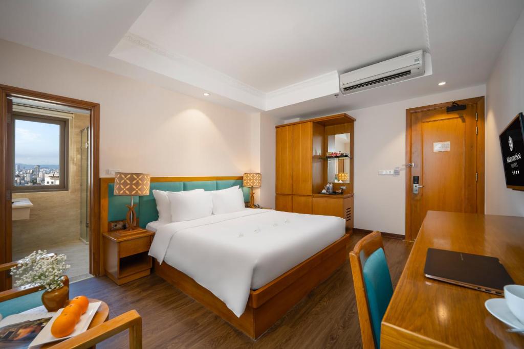 Postel nebo postele na pokoji v ubytování Diamond Sea Hotel