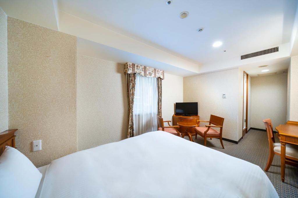 TV a/nebo společenská místnost v ubytování KOKO HOTEL Nagoya Sakae