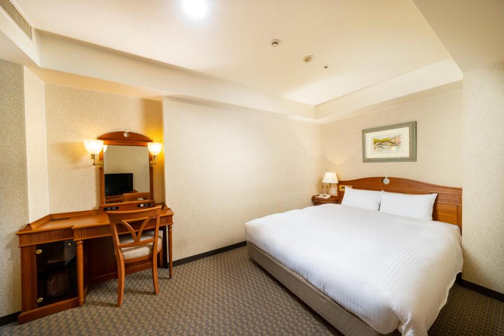 Postel nebo postele na pokoji v ubytování KOKO HOTEL Nagoya Sakae