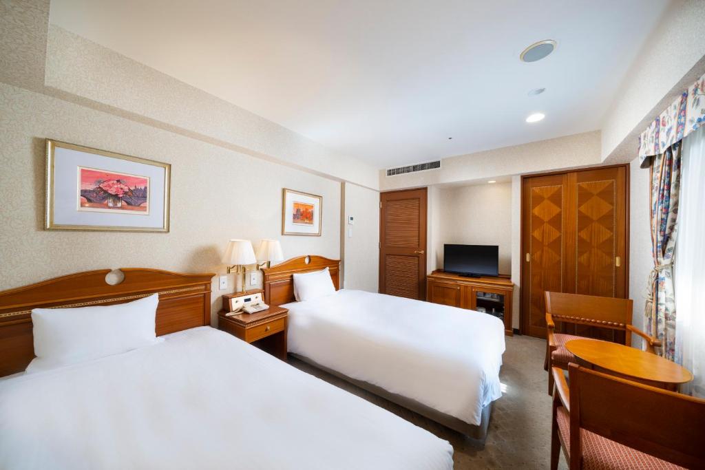Postel nebo postele na pokoji v ubytování KOKO HOTEL Nagoya Sakae