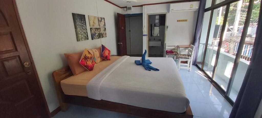 Postel nebo postele na pokoji v ubytování Kohkaew Village 2@Kohsamet