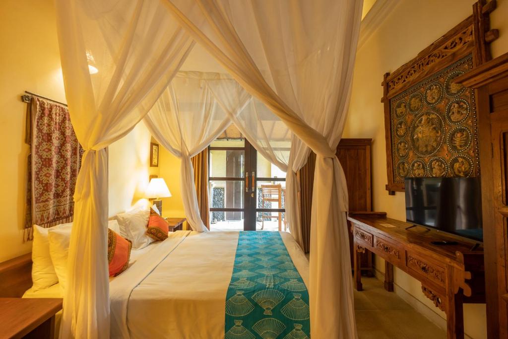 Postel nebo postele na pokoji v ubytování Amertha Bali Villas