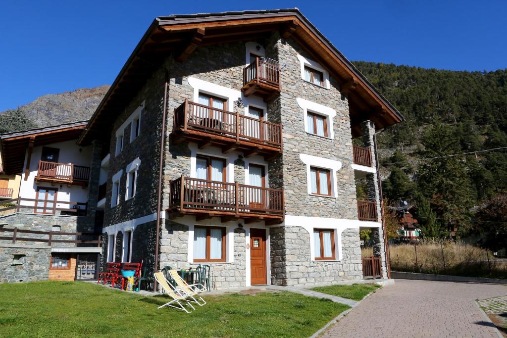 a building with balconies on the side of it at Valley Vacanze in Brusson