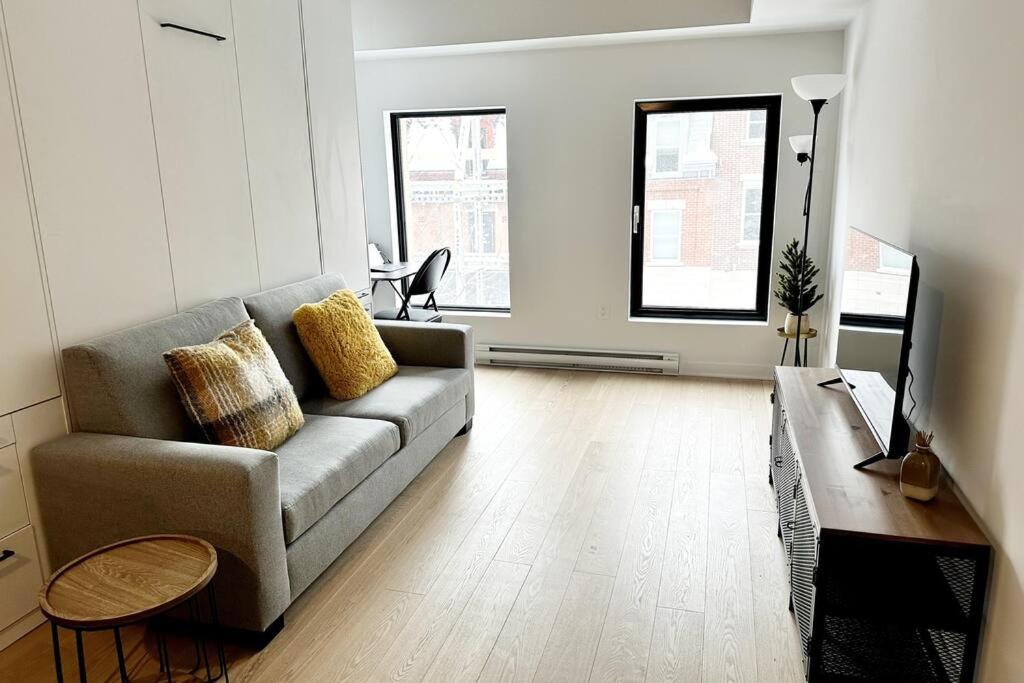 a living room with a couch and a table at 1406 Sainte Elisabeth in Montreal