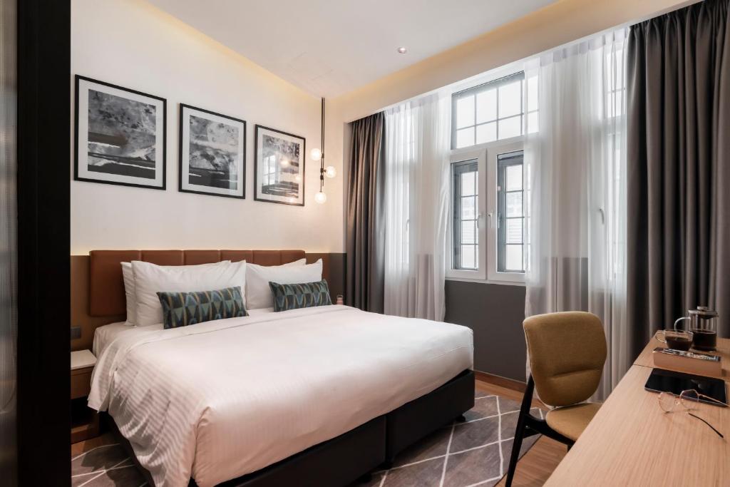 Postel nebo postele na pokoji v ubytování Citadines Connect Georgetown Penang
