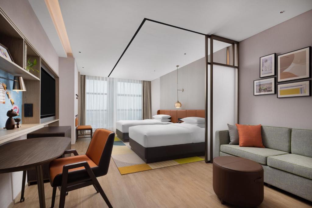 Postel nebo postele na pokoji v ubytování Home2 Suites by Hilton Guiyang Airport