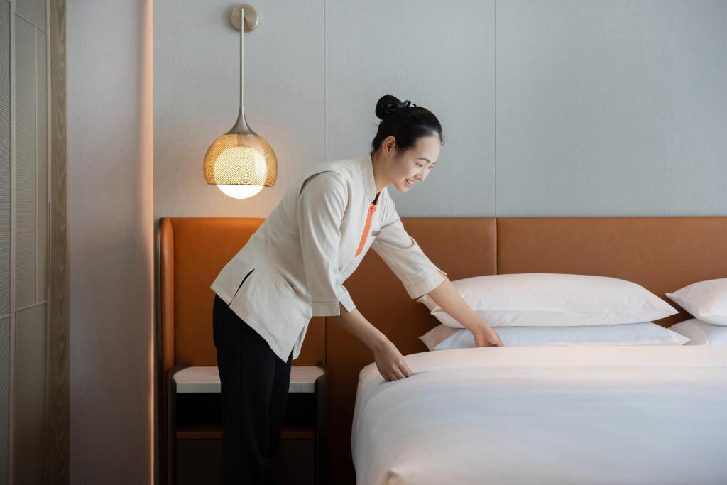 Postel nebo postele na pokoji v ubytování Home2 Suites by Hilton Guiyang Airport