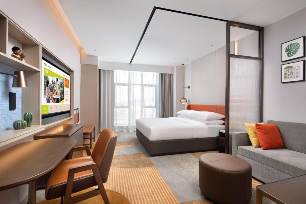 Letto o letti in una camera di Home2 Suites By Hilton Shenzhen Dalang