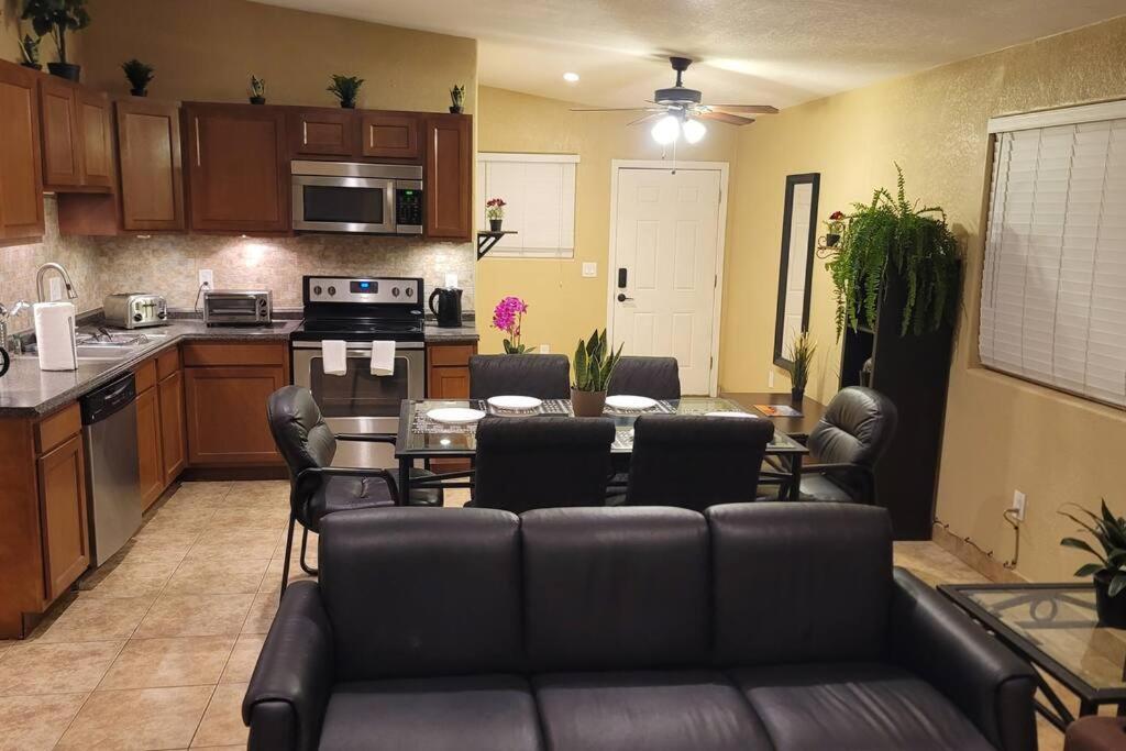 a kitchen and living room with a couch and a table at 3 Bedroom, 2 Bath Whole House, ASU, Tempe, Scottsdale on Light Rail in Mesa