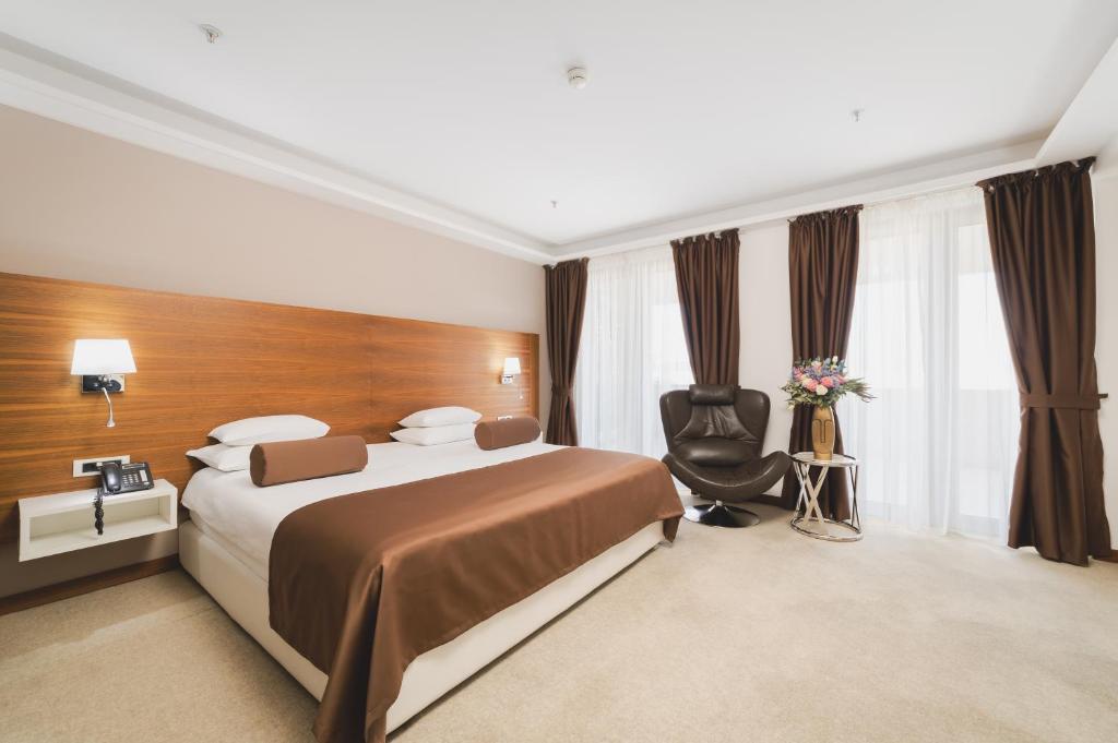 Postel nebo postele na pokoji v ubytování Hotel Aurel
